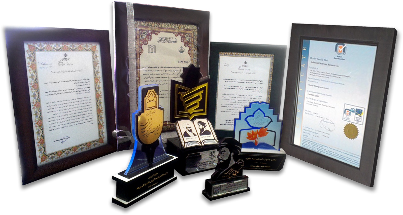 Framed certificates and award trophies received by Ali Rajabpour Sanati